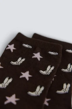 Chaussette longue &agrave; motifs bottes et &eacute;toiles